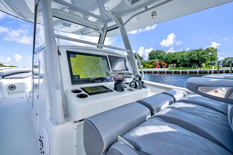  Yacht Photos Pics 2021 Yellowfin 39 boat interior with navigation system and luxurious seating.