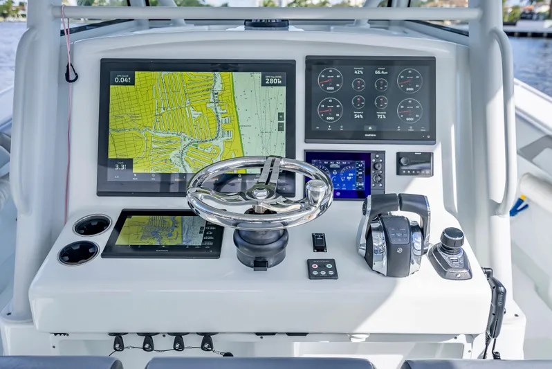  Yacht Photos Pics 2021 Yellowfin 39 boat dashboard with navigation screens and controls.