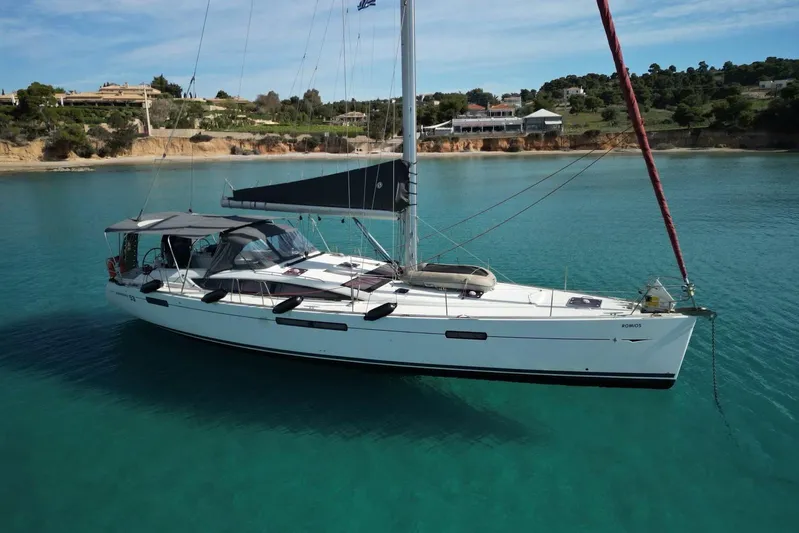  Yacht Photos Pics Sailing yacht Jeanneau 53, 2011 model, anchored in clear turquoise waters.