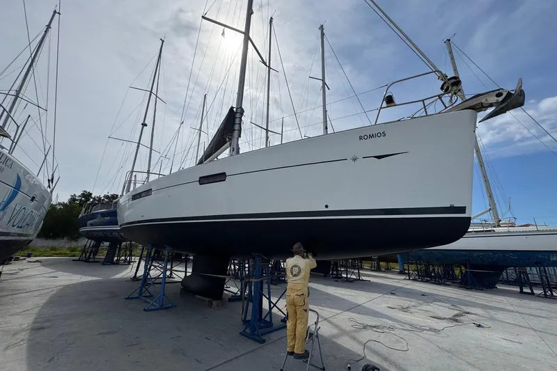  Yacht Photos Pics 2011 Jeanneau 53 sailboat on stands, undergoing maintenance in a boatyard.