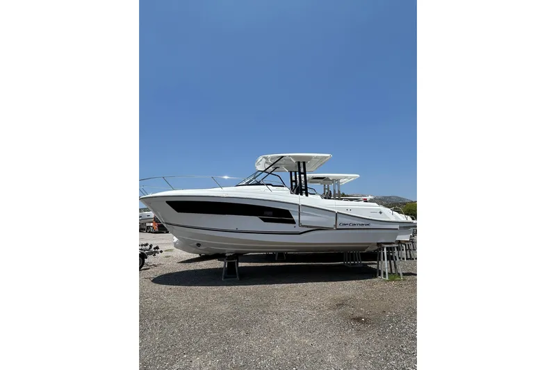  Yacht Photos Pics 2025 Jeanneau CAP CAMARAT 9.0WA SERIE 2 boat on display under clear blue sky.
