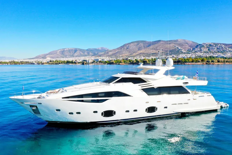  Yacht Photos Pics Luxurious 2012 Custom Line 100 yacht cruising in clear blue waters.