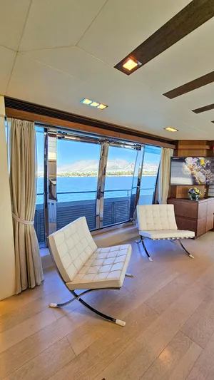  Yacht Photos Pics Luxurious interior of 2012 Custom Line 100 yacht with modern seating and ocean view.