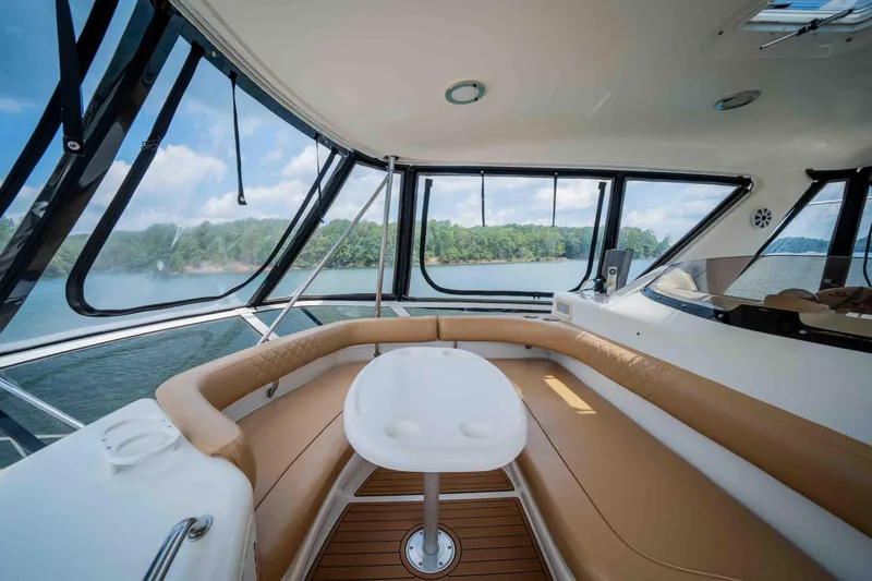  Yacht Photos Pics 1999 Sea Ray 480 Sedan Bridge interior with panoramic lake view and luxurious seating.