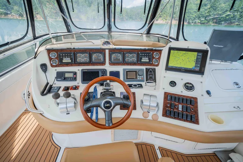  Yacht Photos Pics 1999 Sea Ray 480 Sedan Bridge helm with advanced navigation and control systems.