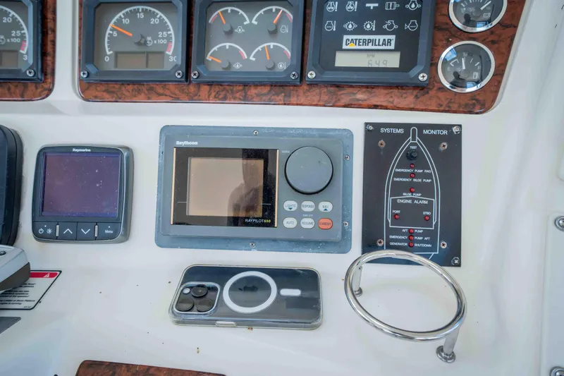  Yacht Photos Pics Control panel of a 1999 Sea Ray 480 Sedan Bridge with navigation and monitoring systems.