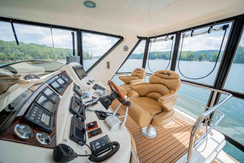  Yacht Photos Pics Luxurious 1999 Sea Ray 480 Sedan Bridge yacht interior with leather seating and advanced controls.