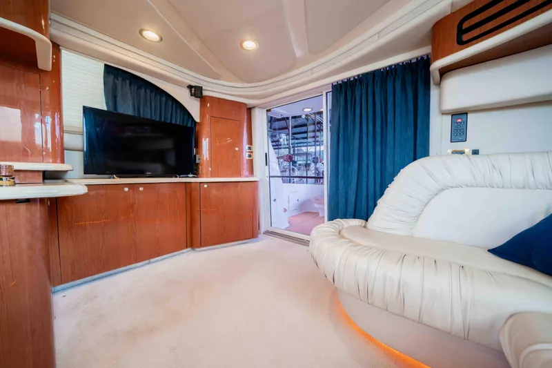  Yacht Photos Pics Luxurious interior of 1999 Sea Ray 480 Sedan Bridge yacht with plush seating and modern amenities.