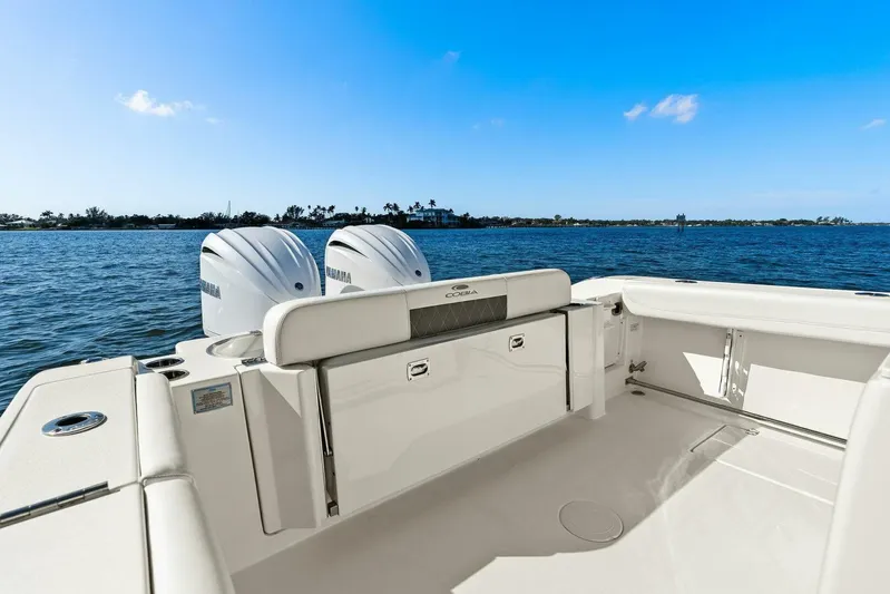  Yacht Photos Pics 2023 Cobia 301 Center Console boat with twin Yamaha engines on open water.