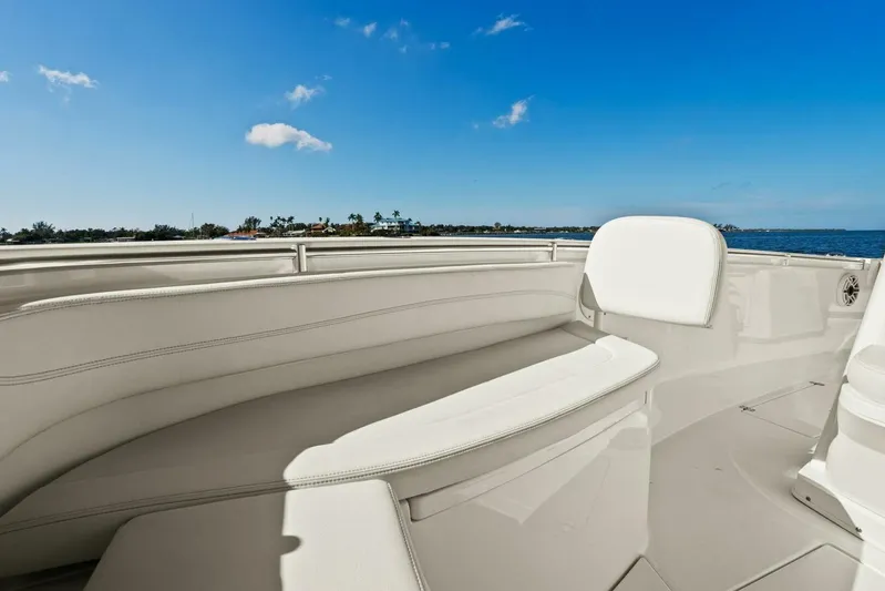 Yacht Photos Pics 2023 Cobia 301 Center Console boat interior with white seating, ocean view.