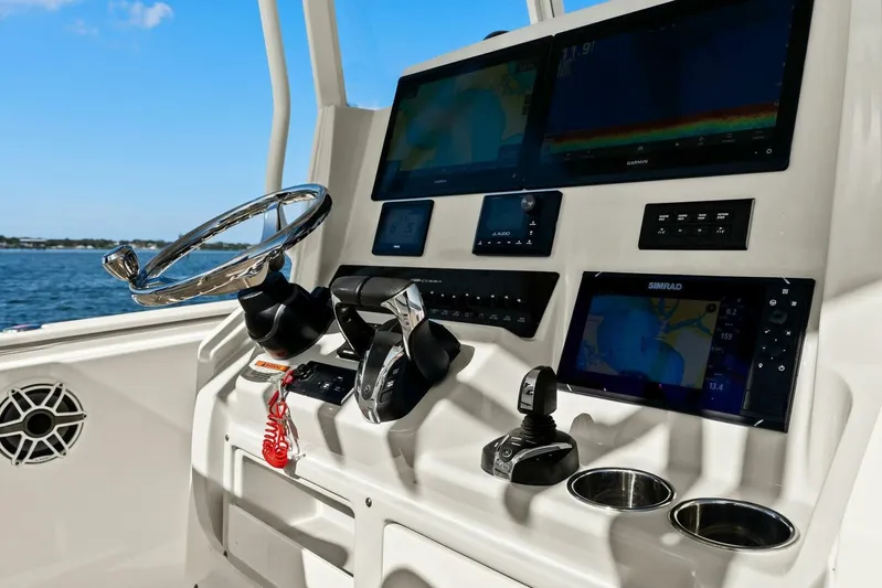  Yacht Photos Pics 2023 Cobia 301 Center Console dashboard with advanced navigation and control systems.