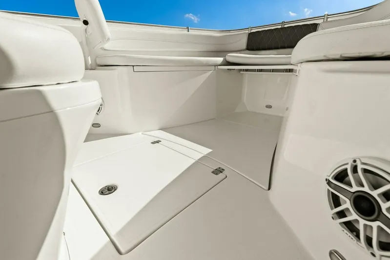  Yacht Photos Pics 2023 Cobia 301 Center Console boat interior with seating and storage compartments.