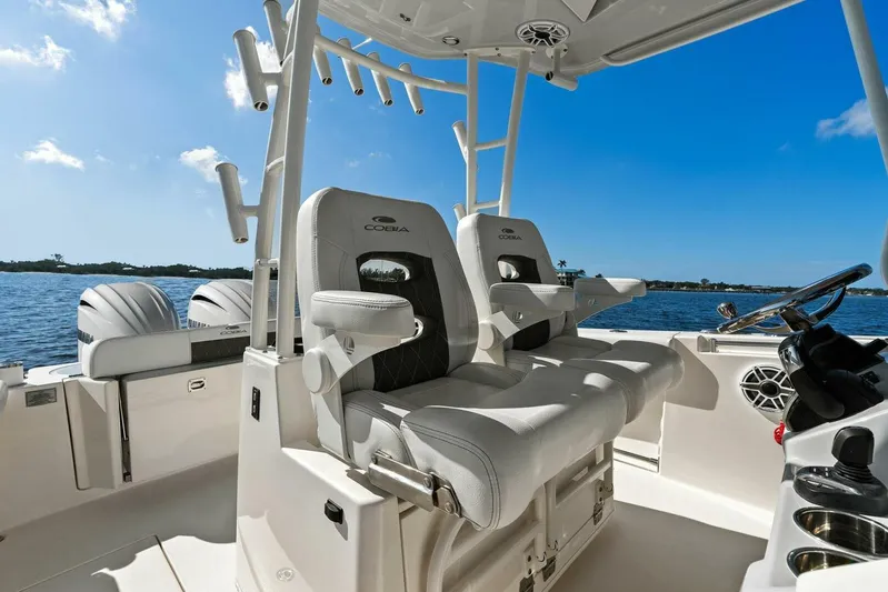  Yacht Photos Pics 2023 Cobia 301 Center Console boat interior with dual seats and ocean view.