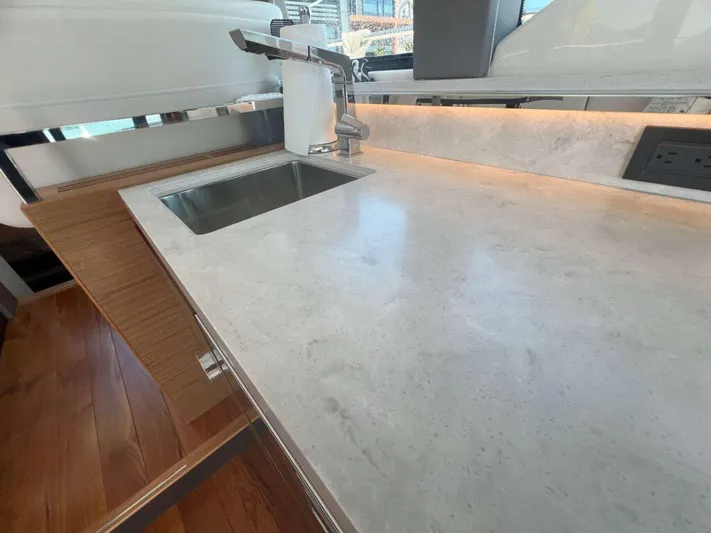  Yacht Photos Pics Modern kitchen countertop in 2022 Tiara Yachts C44 Coupe with sink and faucet.