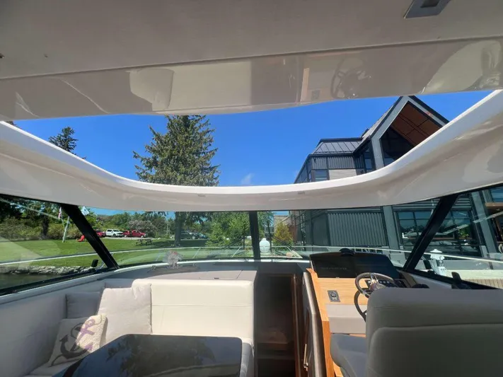  Yacht Photos Pics Interior view of 2022 Tiara Yachts C44 Coupe with open sunroof and modern design.