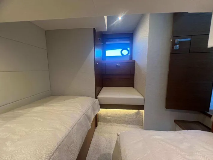  Yacht Photos Pics 2022 Tiara Yachts C44 Coupe interior cabin with twin beds and modern design.