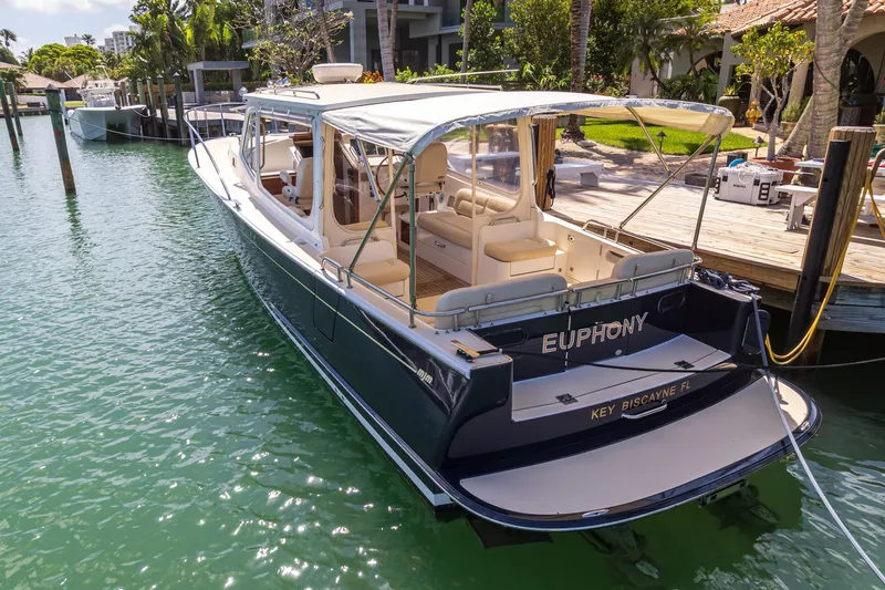 Euphony Yacht Photos Pics 2013 MJM 36z Downeast boat docked in a sunny marina.