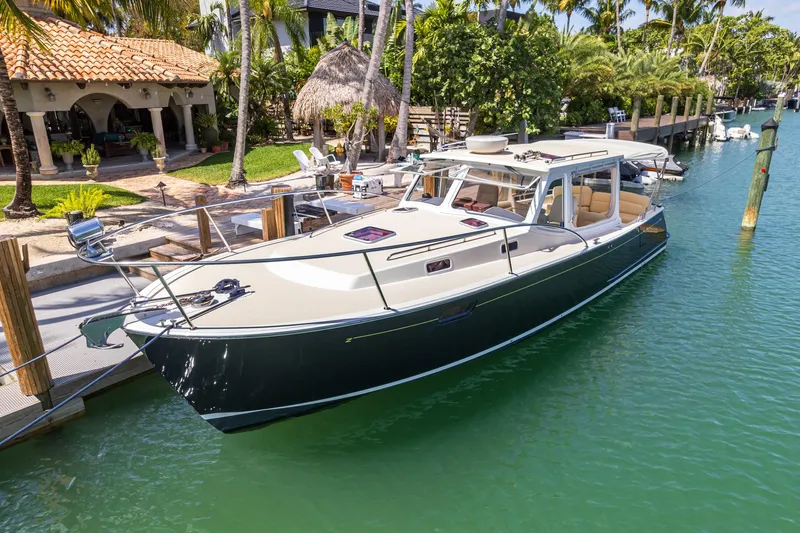 Euphony Yacht Photos Pics 2013 MJM 36z Downeast boat docked in a tropical marina setting.