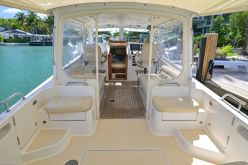 Euphony Yacht Photos Pics 2013 MJM 36z Downeast boat interior with seating, clear panels, and wooden flooring.