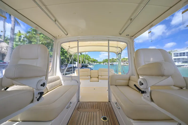 Euphony Yacht Photos Pics Luxurious interior of 2013 MJM 36z Downeast yacht with plush seating and scenic water view.