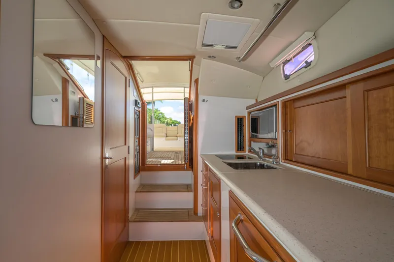Euphony Yacht Photos Pics Interior of 2013 MJM 36z Downeast yacht with wooden cabinetry and modern amenities.