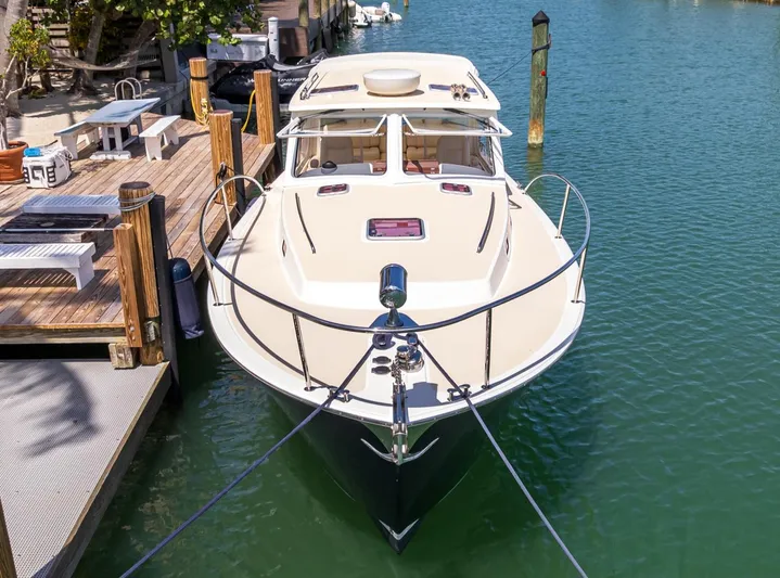 Euphony Yacht Photos Pics 2013 MJM 36z Downeast boat docked in a serene marina setting.
