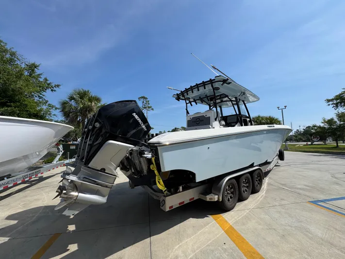  Yacht Photos Pics 2022 Fountain 38TE boat on trailer with Mercury outboard engines, parked outdoors.