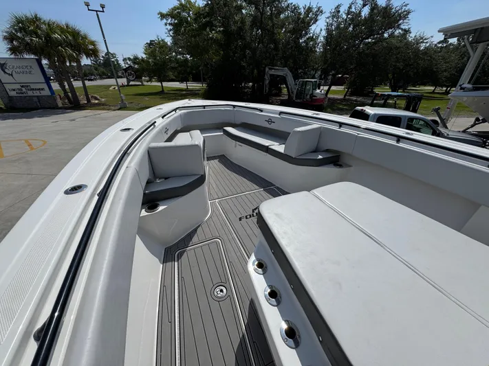  Yacht Photos Pics 2022 Fountain 38TE boat interior with spacious seating and sleek design.