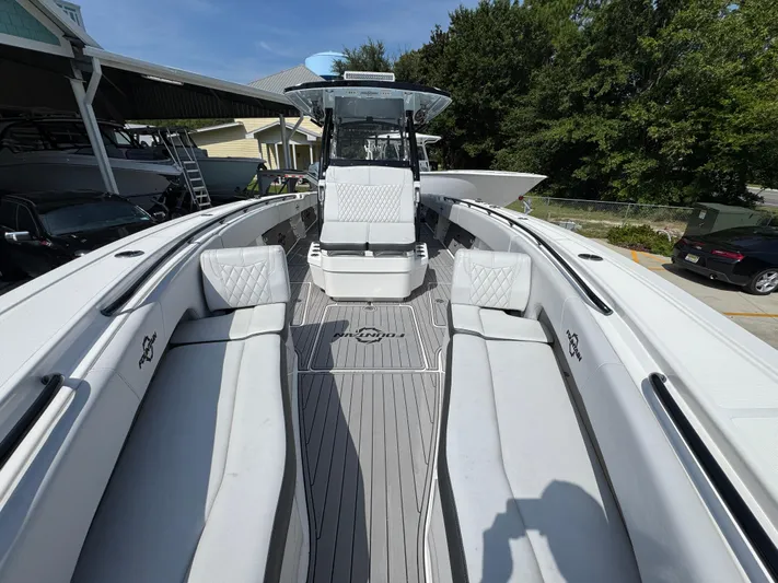  Yacht Photos Pics 2022 Fountain 38TE boat interior with white seating and sleek design.