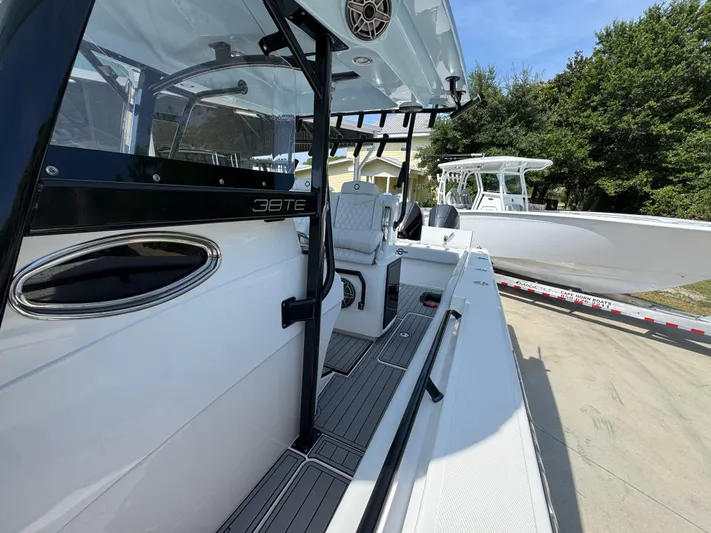  Yacht Photos Pics 2022 Fountain 38TE boat on trailer, sleek design, outdoor setting.