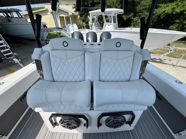  Yacht Photos Pics Luxury seating on a 2022 Fountain 38TE boat, featuring diamond-stitched upholstery.