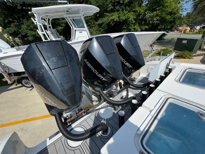  Yacht Photos Pics Triple Mercury outboard engines on a 2022 Fountain 38TE boat, docked outdoors.
