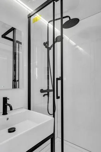  Yacht Photos Pics Modern bathroom with La Mare Modern 11 shower, sleek black fixtures, and white sink, 2024 design.