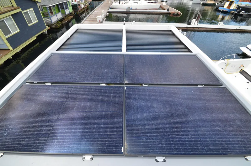  Yacht Photos Pics Solar panels on La Mare Modern 11 houseboat, 2024 model, docked at marina.
