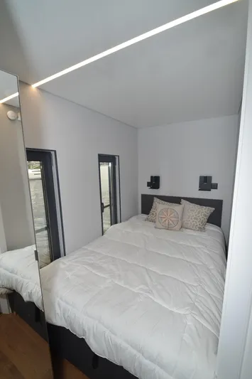  Yacht Photos Pics Compact bedroom in 2024 La Mare Modern 11 houseboat with minimalist design.