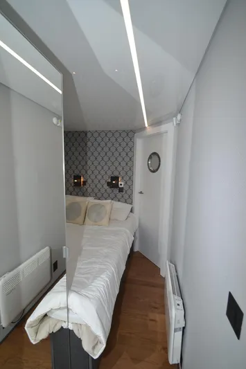  Yacht Photos Pics Compact modern bedroom in La Mare Modern 11, 2024 model, featuring sleek design and minimalist decor.