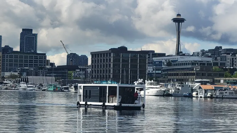  Yacht Photos Pics Houseboat "La Mare Modern 11" on Seattle waters with skyline and Space Needle, 2024.