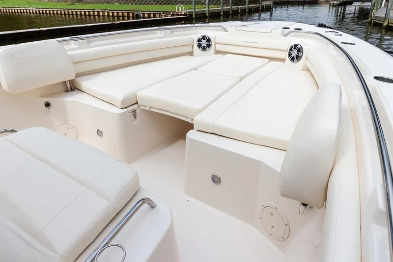  Yacht Photos Pics Manufacturer Provided Image: 2025 Grady-White Canyon 336 boat interior with white cushioned seating and speakers.