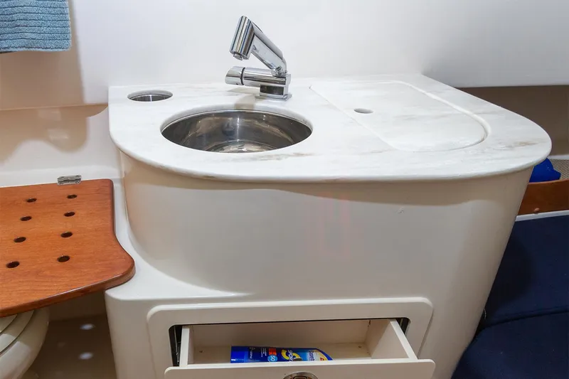 Yacht Photos Pics Manufacturer Provided Image: 2025 Grady-White Canyon 336 boat interior sink with storage drawer open.