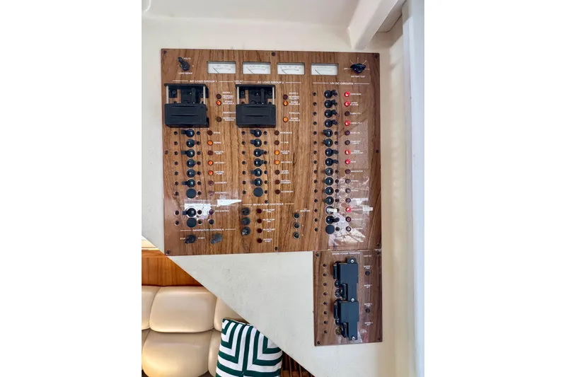 Ripple Yacht Photos Pics Electrical control panel on a 2000 Mainship 390 Trawler boat interior.