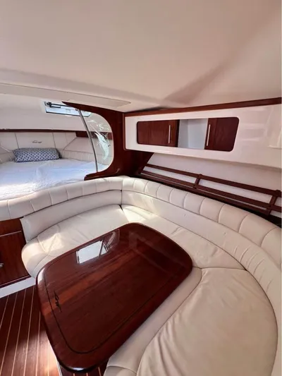  Yacht Photos Pics 2005 Grady-White Express 360 cabin interior with elegant seating and wooden table.