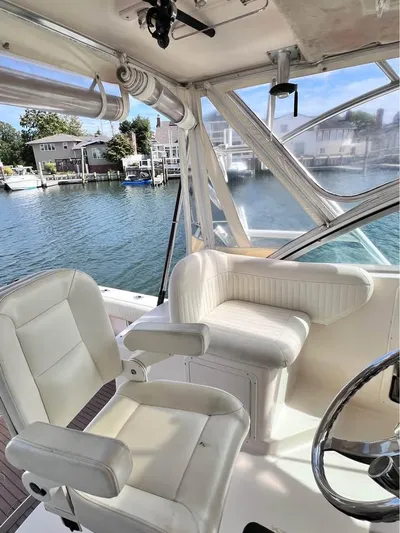  Yacht Photos Pics 2005 Grady-White Express 360 boat interior with white seating and waterfront view.