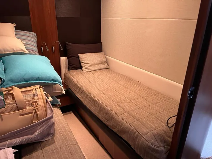  Yacht Photos Pics Cozy cabin interior of 2013 Princess 72 Motor Yacht with twin beds and plush pillows.