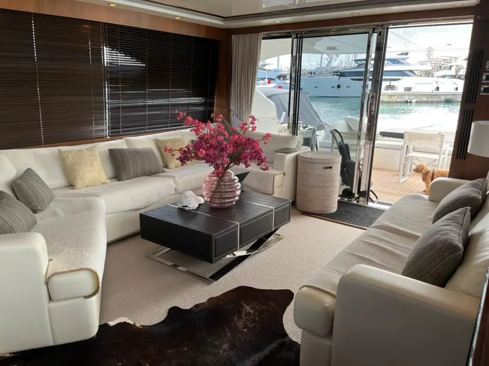  Yacht Photos Pics Luxurious interior of 2013 Princess 72 Motor Yacht with elegant seating and floral centerpiece.