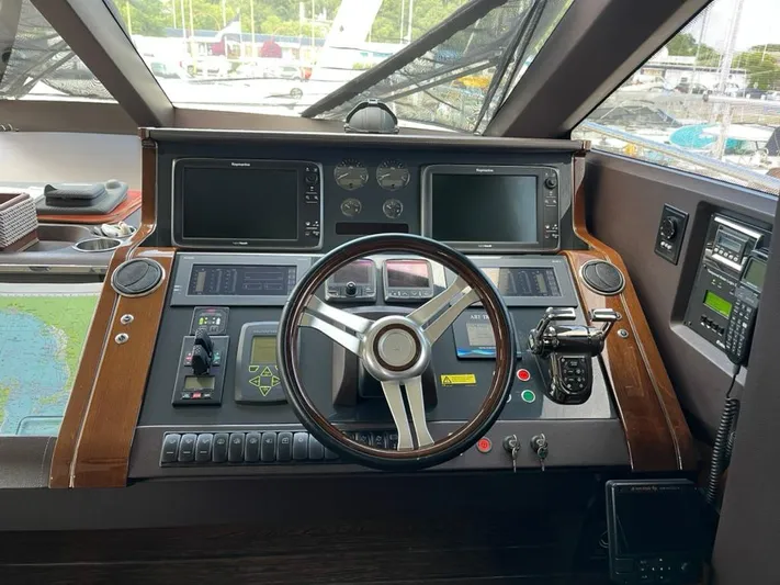  Yacht Photos Pics Cockpit of 2013 Princess 72 Motor Yacht with advanced navigation controls and steering wheel.