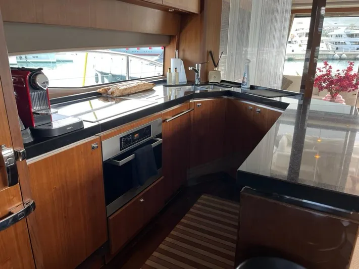  Yacht Photos Pics Luxurious kitchen interior of 2013 Princess 72 Motor Yacht with modern appliances.