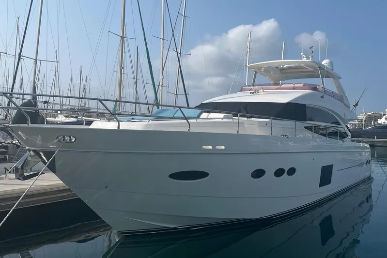  Yacht Photos Pics 2013 Princess 72 Motor Yacht docked in marina, clear sky background.