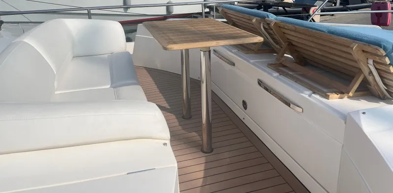  Yacht Photos Pics 2013 Princess 72 Motor Yacht deck with seating and table.