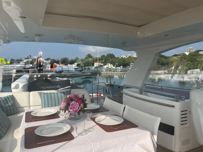  Yacht Photos Pics Luxurious 2013 Princess 72 Motor Yacht with elegant dining setup on deck, docked in scenic marina.