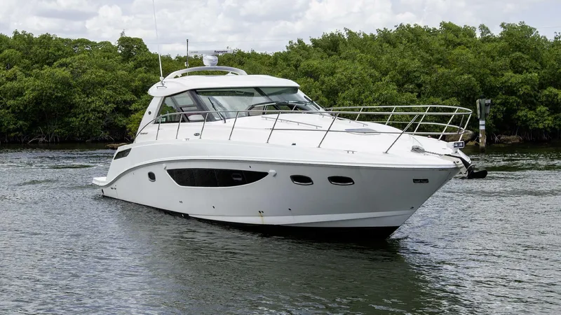  Yacht Photos Pics 2015 Sea Ray 450 Sundancer yacht cruising on a calm waterway.